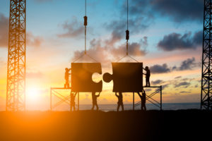 Silhouette Team business engineer work connecting jigsaw puzzle adobestock 132904904