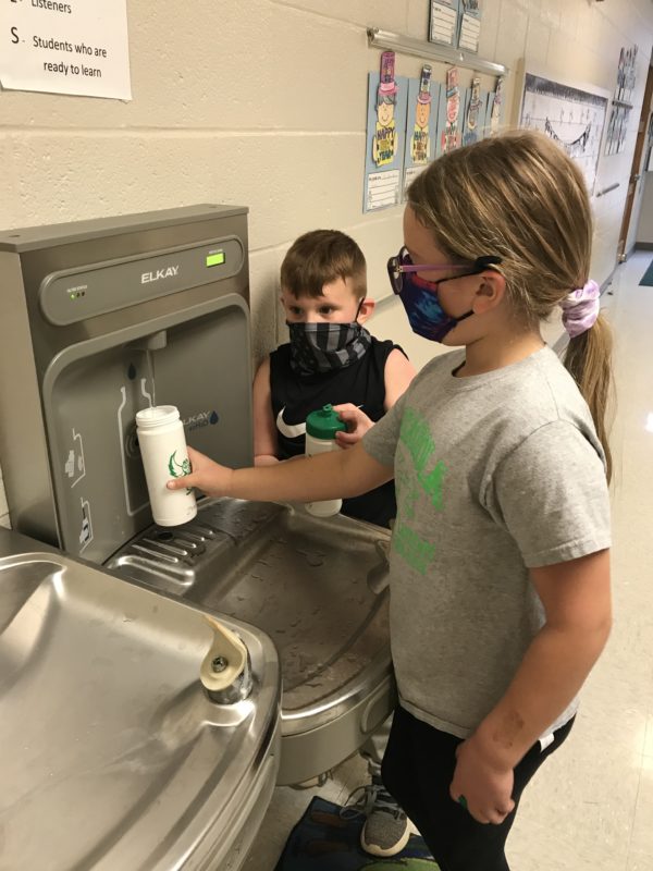 Photo of children getting water from new bottle filling station in school in Silex, Missouri