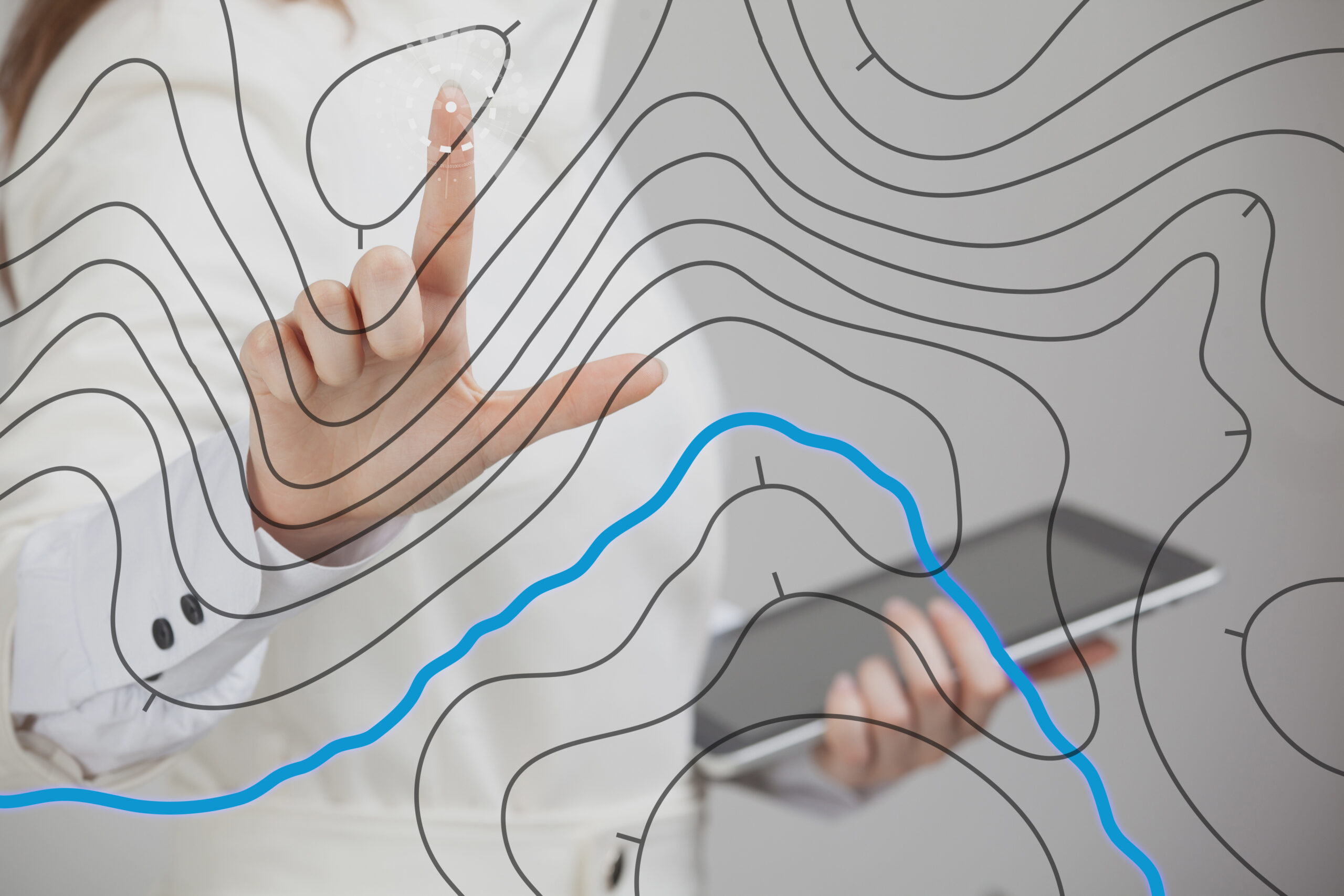 Geographic information systems concept woman scientist working with futuristic GIS interface on a transparent screen